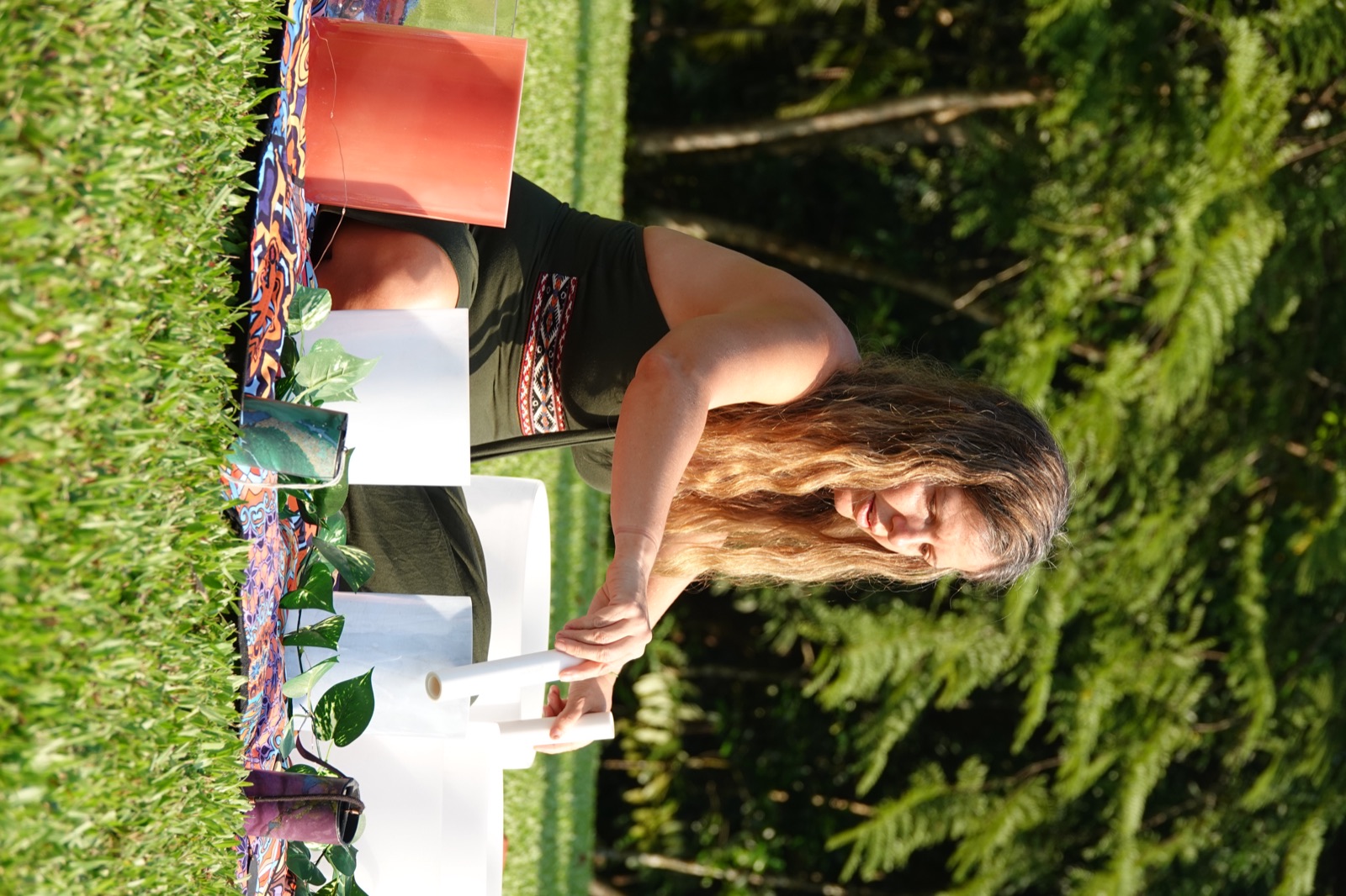 Setting up the crystal singing bowls on the lawn before the evening