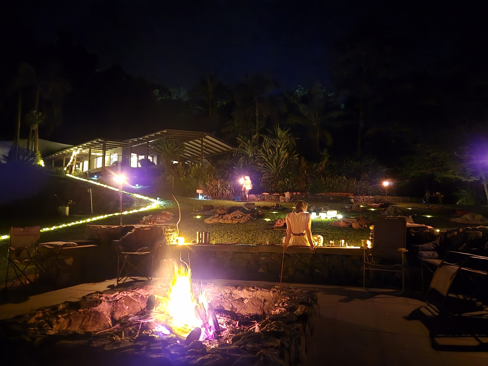 The campfire burning late into the evening